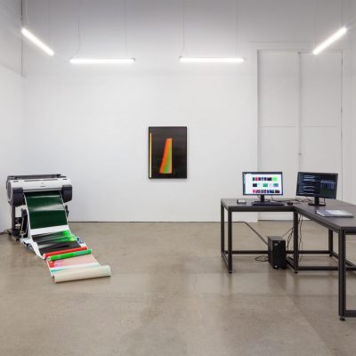 All We'd Ever Need Is One Another (Trio), 2019. Vue de l'installation. 3 flat bed scanners, 4 networked PC computers, large format printer, office supplies, office, light, inkjet prints, website, twitter, instagram.