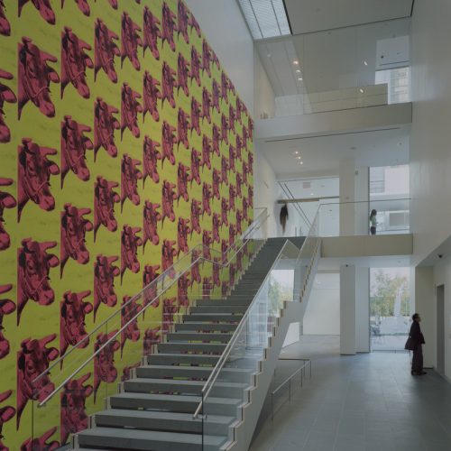 Museum of Modern Arts, New York. Staircase to 2nd floor with Andy Warhol's Cow wallpaper in The Lewis B. and Dorothy Cullman Education and Research Building, designed by Yoshio Taniguchi. © 2006 Timothy Hursley. 

Andy Warhol, Cow wallpaper, 1966. 
© 2006 Andy Warhol Foundation for the Visual Arts / Artists Rights Society (ARS), New York